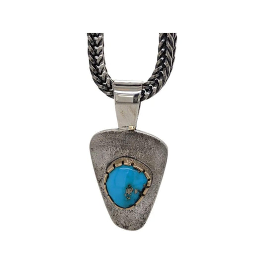 Floating turquoise pendant necklace with a 14K gold bezel on a sterling silver chain.