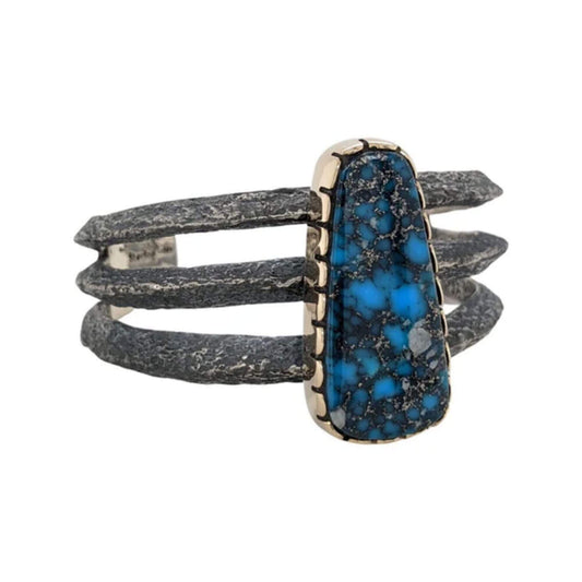 The Arizona - a three-strand Kingman turquoise cuff bracelet with 14K gold accents and a tufa cast design.
