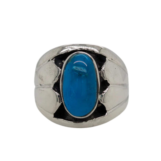 Kingman Turquoise Ring featuring a round cabochon with mesmerizing Turquoise hues in a sterling silver bezel setting.