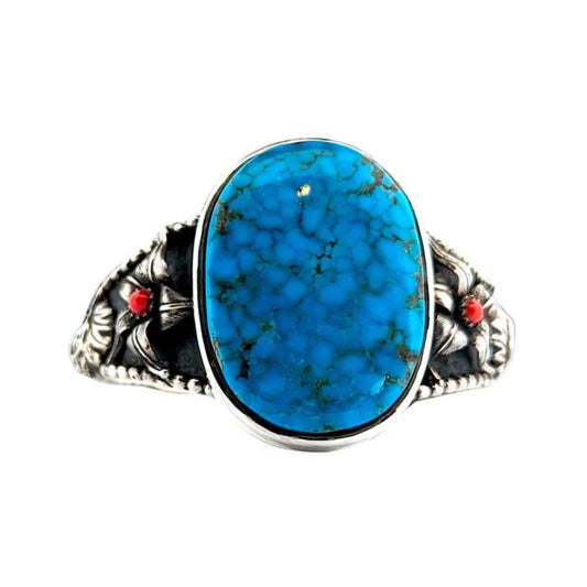 Handmade Southwestern sterling silver cuff bracelet featuring a deep blue Kingman turquoise stone with hints of green and a subtle Southwestern design.